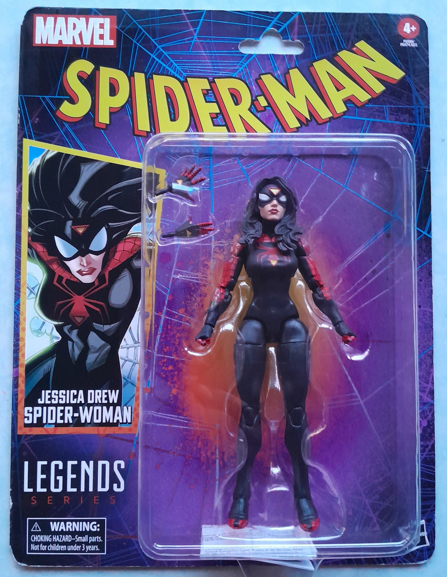 Spider-Man action figure in packaging with Spider-Woman design on a blue background